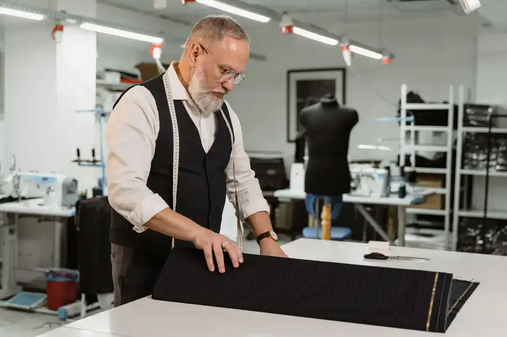 Tailor measuring fabric for puppet clothing